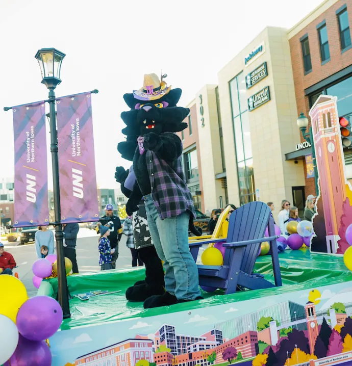 TC on float at Homecoming parade